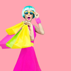 crazy fashion shopping girl on yellow background